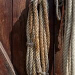 a close up of ropes on a wooden wall